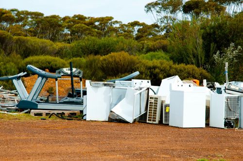 pile of appliances from cleaning out apartment complex